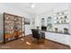 Bright home office with custom built-in shelves and drawers, offering both style and practicality at 4676 Tuscana Dr, Sarasota, FL 34241