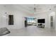 Spacious living room with floor to ceiling windows and view of the backyard pool at 4676 Tuscana Dr, Sarasota, FL 34241