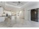 Open living area with kitchen, tile flooring and plenty of space for entertaining at 4676 Tuscana Dr, Sarasota, FL 34241