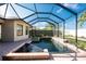 This screened-in pool features brick pavers and a relaxing oasis at 4676 Tuscana Dr, Sarasota, FL 34241
