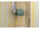 Cozy bathroom featuring shower with glass door and patterned wallpaper at 5488 Holiday Park Blvd, North Port, FL 34287