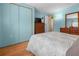 Bedroom with a dresser and a view to the ensuite bath at 5488 Holiday Park Blvd, North Port, FL 34287