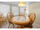 Charming dining room with round table, patterned chairs, and a cozy atmosphere at 5488 Holiday Park Blvd, North Port, FL 34287