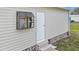 Exterior shot with decorative window and door at 5488 Holiday Park Blvd, North Port, FL 34287