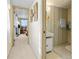 Hallway view leads to a bathroom and bedroom with blue accents at 5488 Holiday Park Blvd, North Port, FL 34287