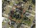 Aerial view of property boundaries in a residential neighborhood with mature trees at 5640 Burdette Ter, North Port, FL 34287