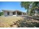 Expansive backyard featuring a screened-in porch and mature trees for shade at 5640 Burdette Ter, North Port, FL 34287