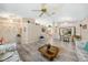 Bright living room with hardwood floors, dining area, and an open concept feel at 5640 Burdette Ter, North Port, FL 34287