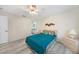 Inviting main bedroom with modern flooring, ceiling fan, and access to an ensuite bathroom at 5640 Burdette Ter, North Port, FL 34287