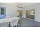 Spacious screened patio features dining area with ceiling fan and access to the kitchen at 5640 Burdette Ter, North Port, FL 34287