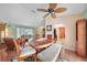 Open-concept dining area with hardwood floors, adjacent to the living room and kitchen at 657 Hartford Nw Dr, Port Charlotte, FL 33952