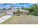 Charming single-story home with a well-maintained lawn and attached two-car garage at 657 Hartford Nw Dr, Port Charlotte, FL 33952