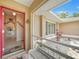 Inviting home foyer with tiled floor, bench, and a glimpse of the interior layout at 657 Hartford Nw Dr, Port Charlotte, FL 33952