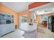 Bright kitchen with breakfast bar area and view of the screened-in pool at 657 Hartford Nw Dr, Port Charlotte, FL 33952