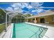 Relax by the screened-in pool, perfect for outdoor entertaining and enjoyment at 657 Hartford Nw Dr, Port Charlotte, FL 33952