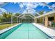 Enjoy the inviting pool with an attached, covered outdoor patio area at 657 Hartford Nw Dr, Port Charlotte, FL 33952
