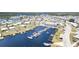 Aerial view of Harbor Cove community featuring a marina, pool, clubhouse, and waterfront homes at 714 Fairmount Dr, North Port, FL 34287
