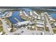 Community aerial view shows the boat docks, pool, clubhouse, shuffleboard, and beautiful surrounding waterways at 714 Fairmount Dr, North Port, FL 34287