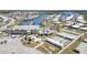 An impressive aerial view showcasing the community's marina, pool, shuffleboard, and central gathering place at 714 Fairmount Dr, North Port, FL 34287