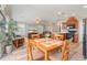 Bright dining room and living area with hardwood floors and modern appliances in the kitchen at 714 Fairmount Dr, North Port, FL 34287