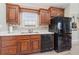 Well-lit kitchen with stainless steel appliances, hardwood cabinets and marble countertops at 714 Fairmount Dr, North Port, FL 34287