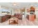 Cozy living room with hardwood floors, and an open-concept layout with kitchen access at 714 Fairmount Dr, North Port, FL 34287