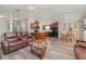 Spacious living room open to the kitchen and dining area with hardwood floors at 714 Fairmount Dr, North Port, FL 34287