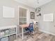 Functional home office with a desk, rolling chair, and organized storage at 714 Fairmount Dr, North Port, FL 34287