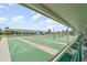 Community shuffleboard courts provide recreational space with shade and seating for players and spectators at 714 Fairmount Dr, North Port, FL 34287