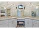 Elegant bathroom featuring double sinks, granite countertops, and ample storage at 719 Ellicott Nw Cir, Port Charlotte, FL 33952