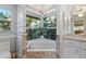 Bathroom features a soaking tub under a window at 719 Ellicott Nw Cir, Port Charlotte, FL 33952