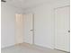 Bedroom featuring carpet flooring and closet at 719 Ellicott Nw Cir, Port Charlotte, FL 33952