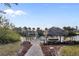 This property features a dock on the water with a tiki hut and boat lift at 719 Ellicott Nw Cir, Port Charlotte, FL 33952