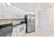 Clean kitchen featuring stainless steel appliances and granite countertops at 719 Ellicott Nw Cir, Port Charlotte, FL 33952