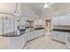 Bright kitchen featuring an island, granite countertops, and pool view at 719 Ellicott Nw Cir, Port Charlotte, FL 33952