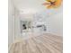 Bright living room with neutral color walls, tile and plank flooring at 719 Ellicott Nw Cir, Port Charlotte, FL 33952