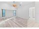 Living room with cathedral ceiling, neutral walls, and plank flooring at 719 Ellicott Nw Cir, Port Charlotte, FL 33952