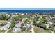 Stunning aerial view of a waterfront community with lush landscaping and sparkling blue ocean at 740 W Virginia Ave, Punta Gorda, FL 33950