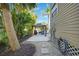 Lush backyard features a gazebo, tropical plants, and a pea gravel walkway at 740 W Virginia Ave, Punta Gorda, FL 33950