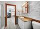 Bathroom with a view into the office and unique signature walls at 740 W Virginia Ave, Punta Gorda, FL 33950