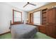 Bedroom with natural light, closet, and built-in desk and bookcase at 740 W Virginia Ave, Punta Gorda, FL 33950