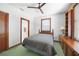 Modest bedroom with single bed, built-in storage, and ceiling fan at 740 W Virginia Ave, Punta Gorda, FL 33950