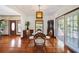Dining room with hardwood floors, stylish light fixture and doors to the porch at 740 W Virginia Ave, Punta Gorda, FL 33950