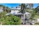 Charming two-story home with a metal roof and a inviting porch at 740 W Virginia Ave, Punta Gorda, FL 33950