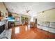 Spacious living room with hardwood floors, a fireplace, and ample natural light, creating a warm and inviting atmosphere at 740 W Virginia Ave, Punta Gorda, FL 33950