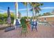 Inviting backyard pool area with outdoor seating and lush landscaping, ideal for relaxation at 740 W Virginia Ave, Punta Gorda, FL 33950