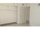 Bright bedroom with built-in shelving and closet space, offering practicality at 8544 Herbison Ave, North Port, FL 34287