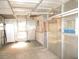 Spacious garage featuring ample storage, natural lighting, and secure entry for vehicles and equipment at 8544 Herbison Ave, North Port, FL 34287