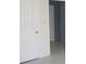 Hallway showcases tile floors, a storage closet, and neutral walls at 8544 Herbison Ave, North Port, FL 34287