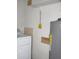 Functional laundry area includes washing machine, water heater and basic shelving for storage solutions at 8544 Herbison Ave, North Port, FL 34287